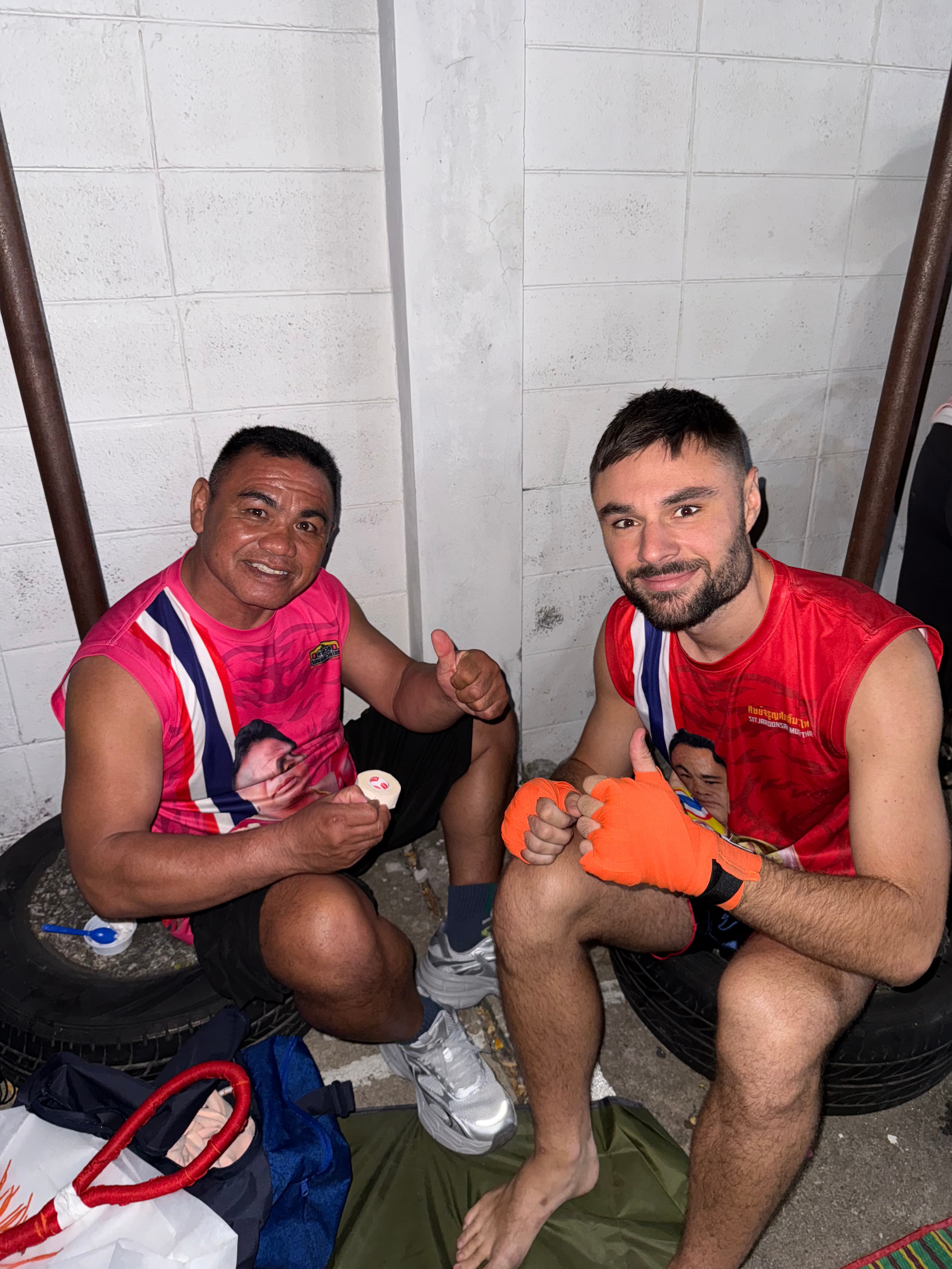 Hand wrapping before Muay Thai training at Sit Jaroonsak