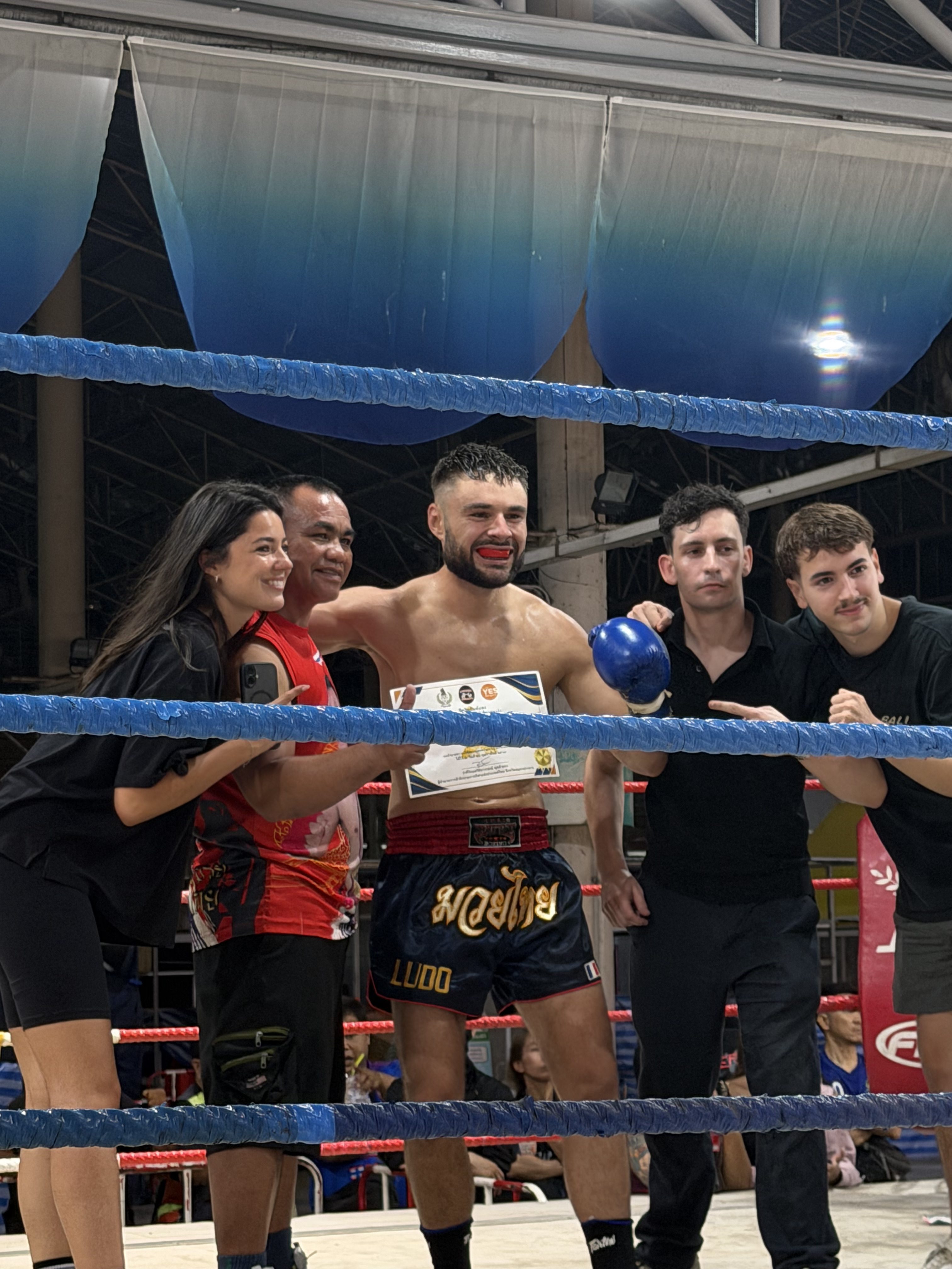 Victory moment after successful Muay Thai fight in Bangkok ring